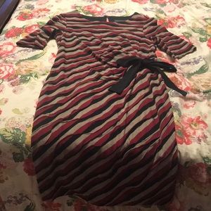 Knee length dress with mid length sleeves.